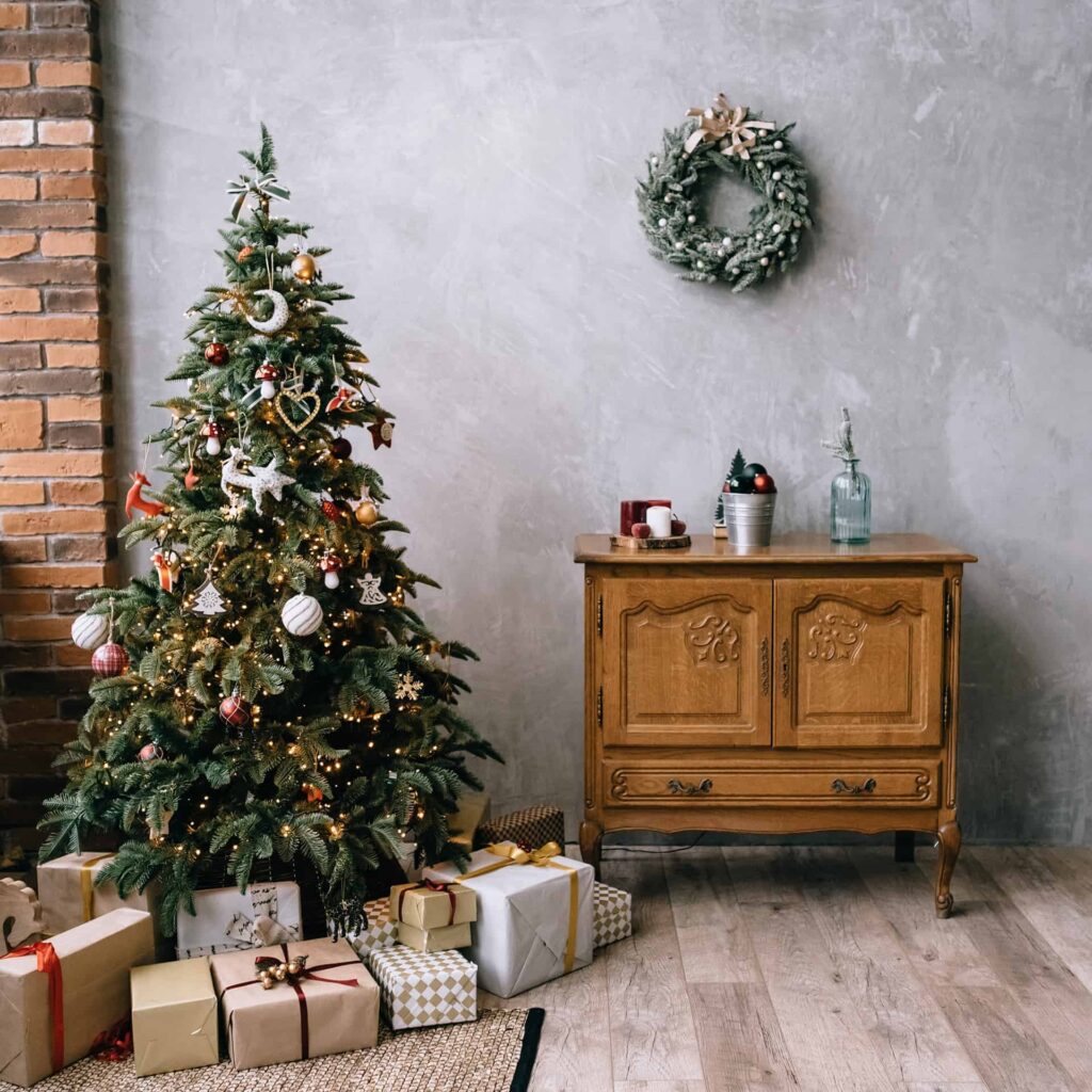 christmas tree with gifts and a table
