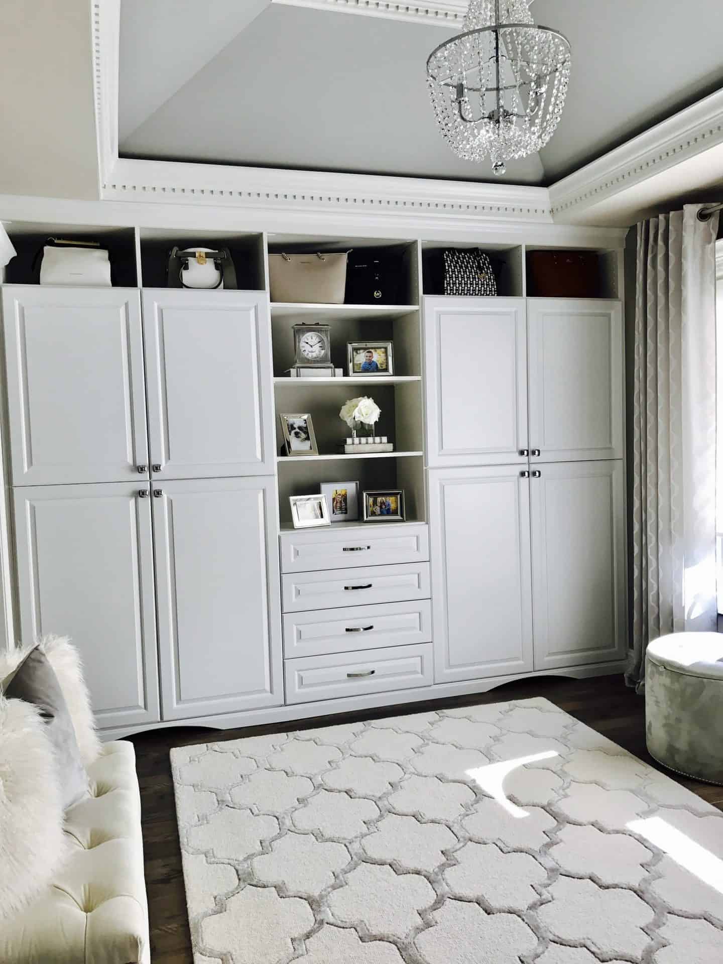 White closet, white carpet and a sofa